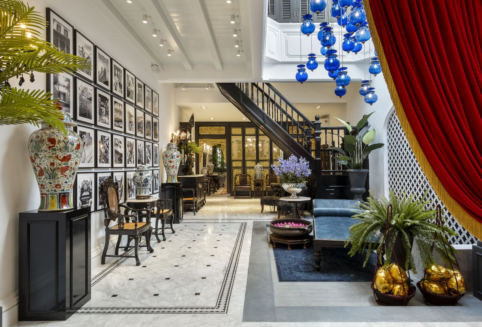 This Middle-Eastern inspired courtyard features Spanish tiles and aquamarine Moroccan pendant lamps