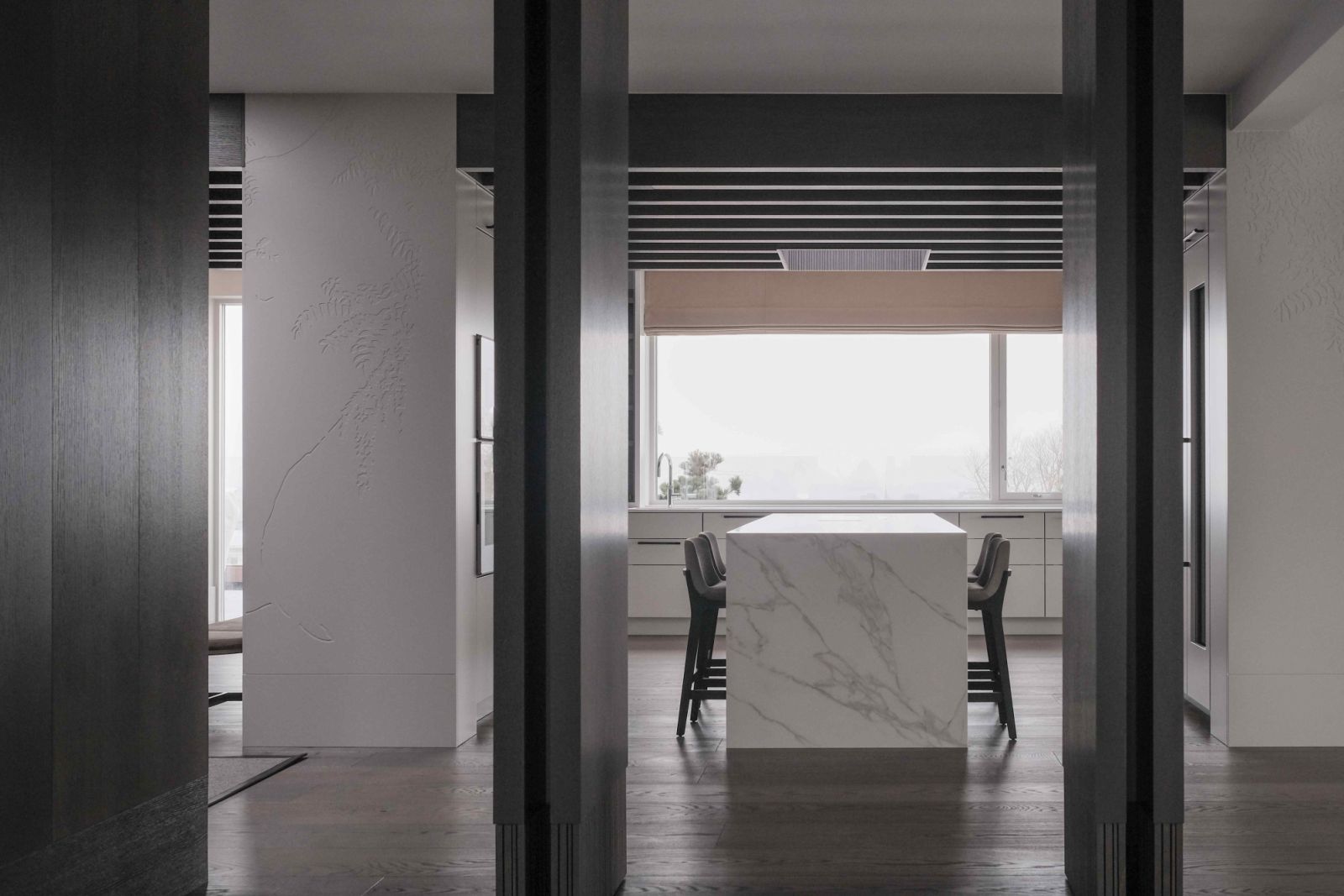 The substantial pivot doors in the kitchen offer unobstructive light and view