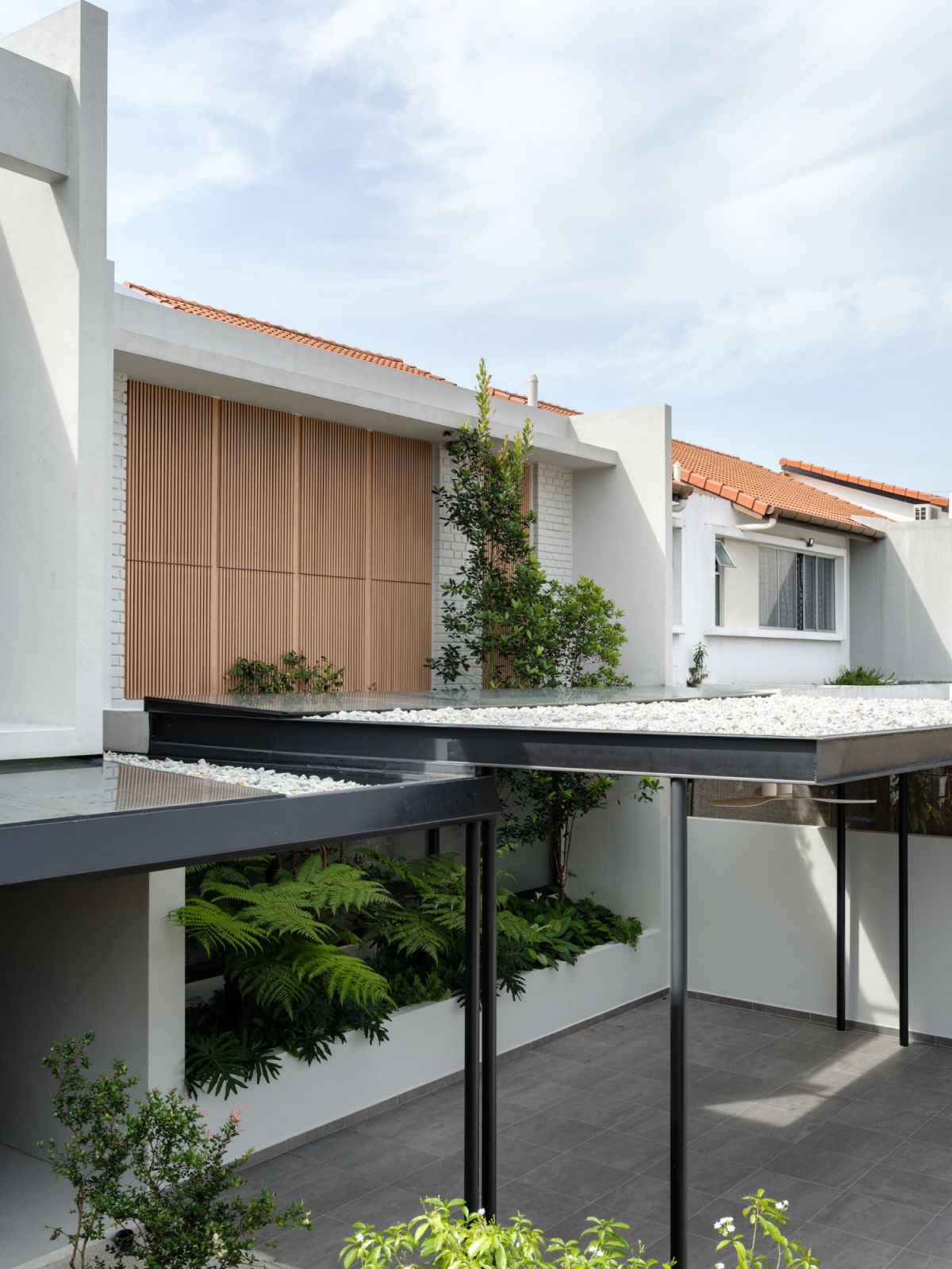 The facade of the house with its timber cladding