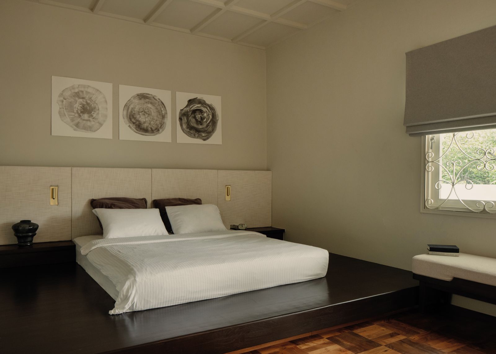 A spacious platform bed and a subtle selection of tactile finishes transform the sleeping quarters into a calming oasis