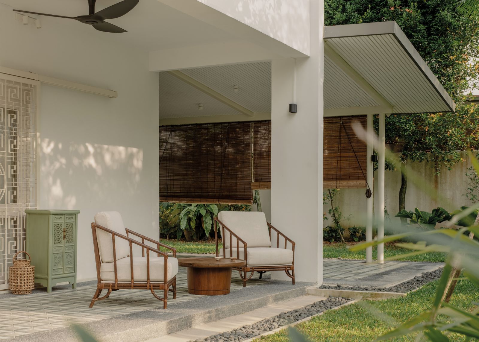 The outdoor areas are clad in encaustic jade-green tiles and furnished with custom pieces