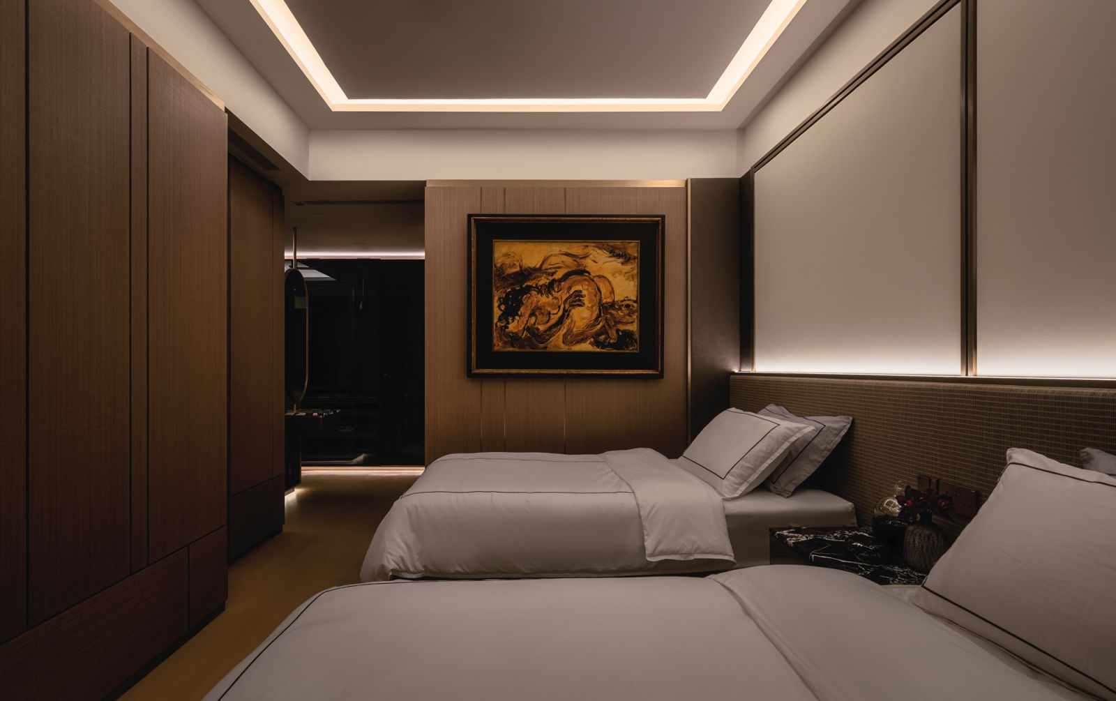 The master bedroom is characterised by delectable chocolate and coffee tones, tempered by creamy hues for a fine balance
