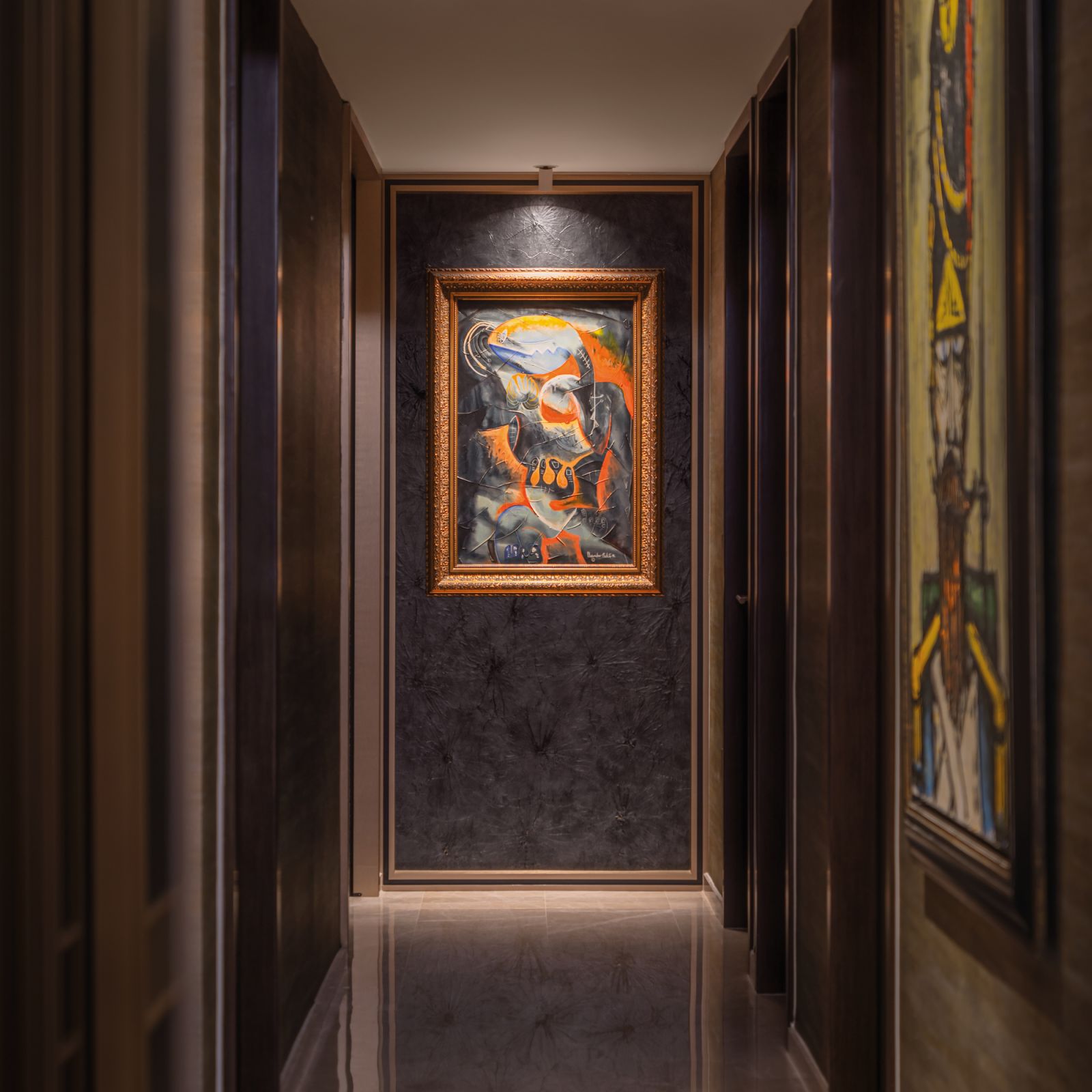 A vibrant painting by Romanian-American artist Alexandra Nechita lifts this moody corridor with bold swathes of colour