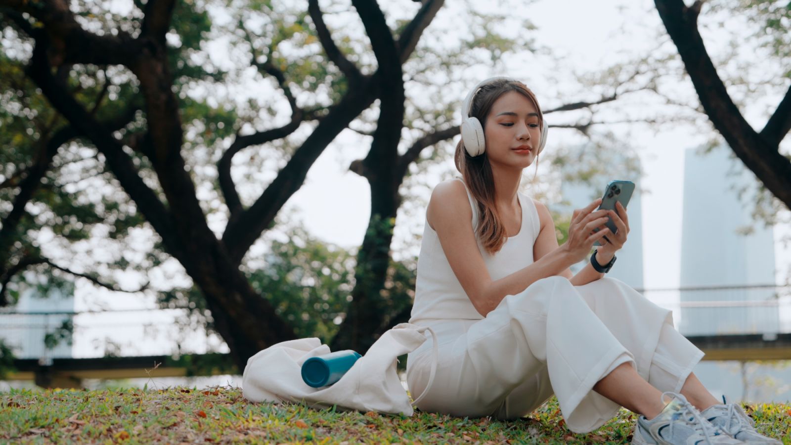 A young woman finds her rhythm amidst the tranquility of a lush park