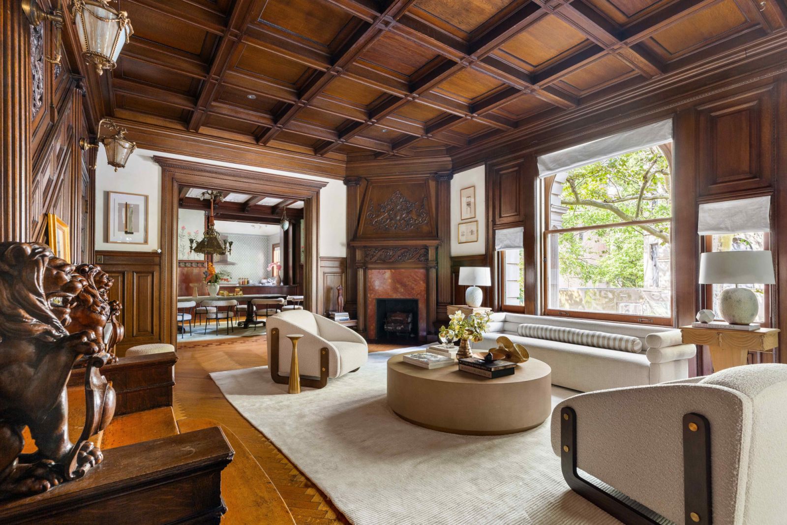 Soft upholstered items juxtapose the weight of the woodwork in the middle parlour