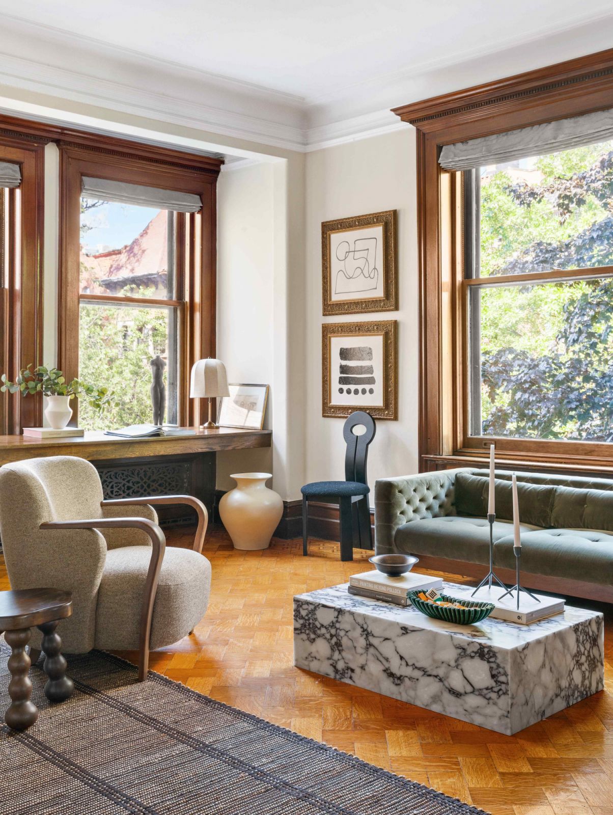 Traditional pieces and modern materials in the main suite sitting area