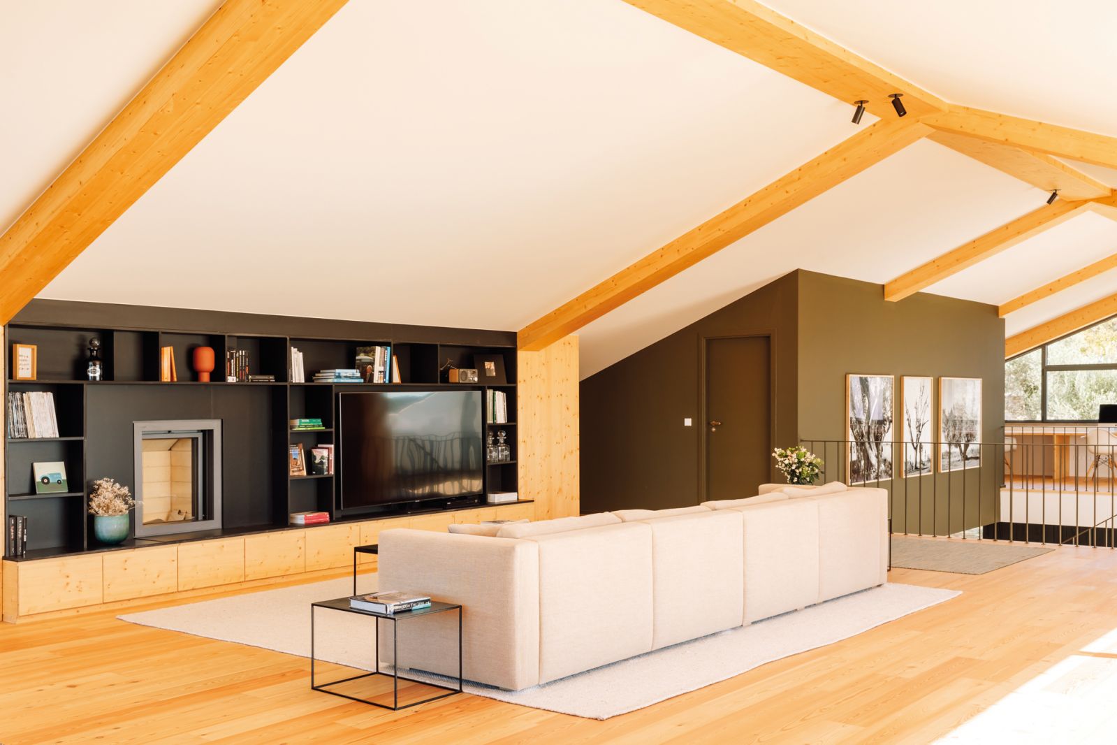 The mezzanine is a multipurpose space incorporating a TV room, office, gym and snug reading nooks