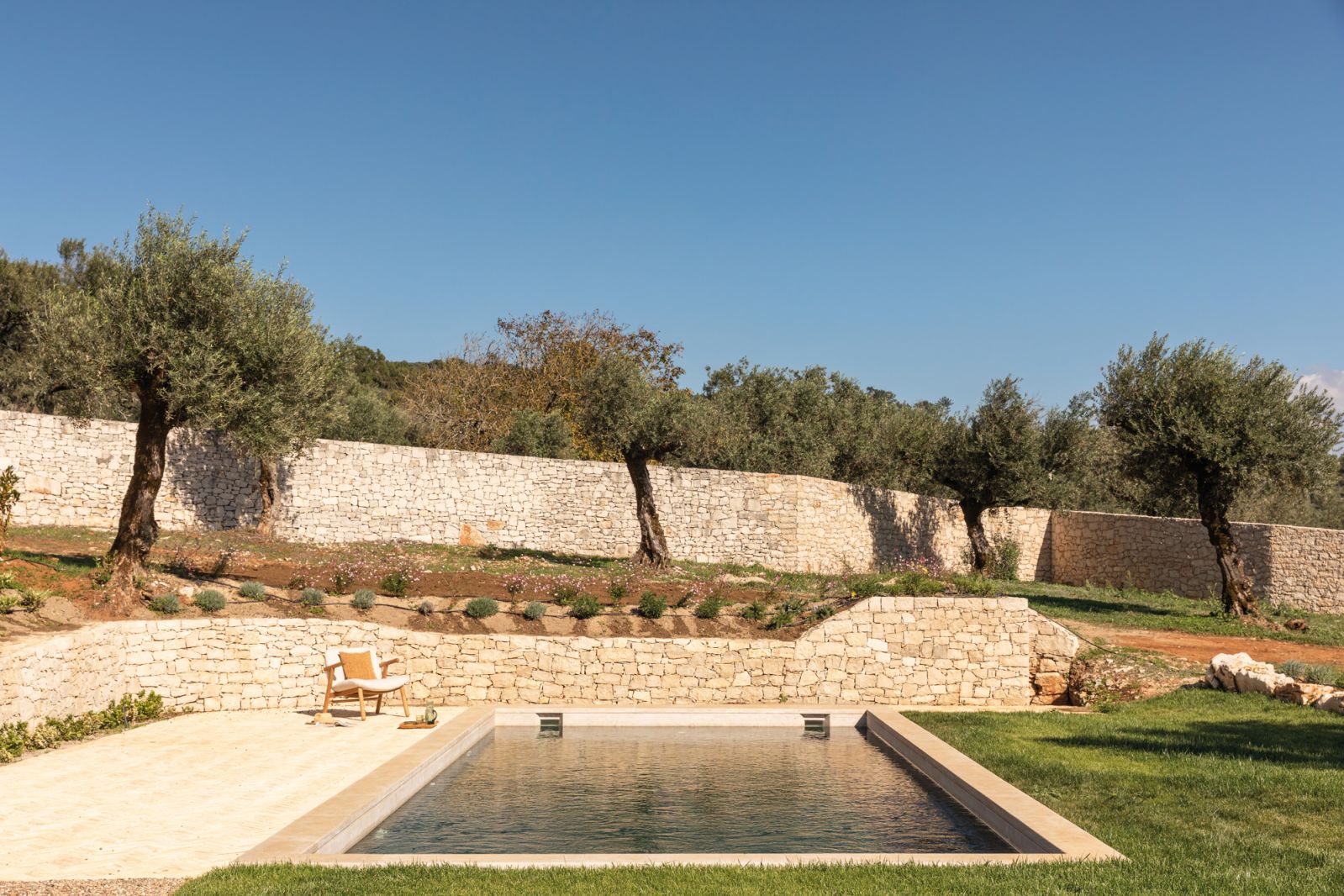 Dotted with olive trees, the bucolic setting and its natural hues proved rich sources of inspiration for the interior designers