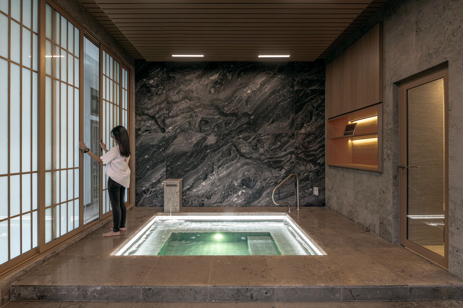 A Japanese-style family onsen is incorporated into the first floor of the house and is used as a family activity regularly