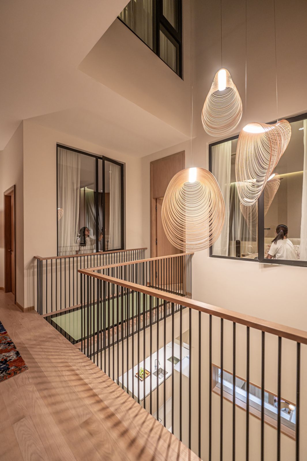 A transparent glass bridge allows for connectivity between rooms, stairways and corridors