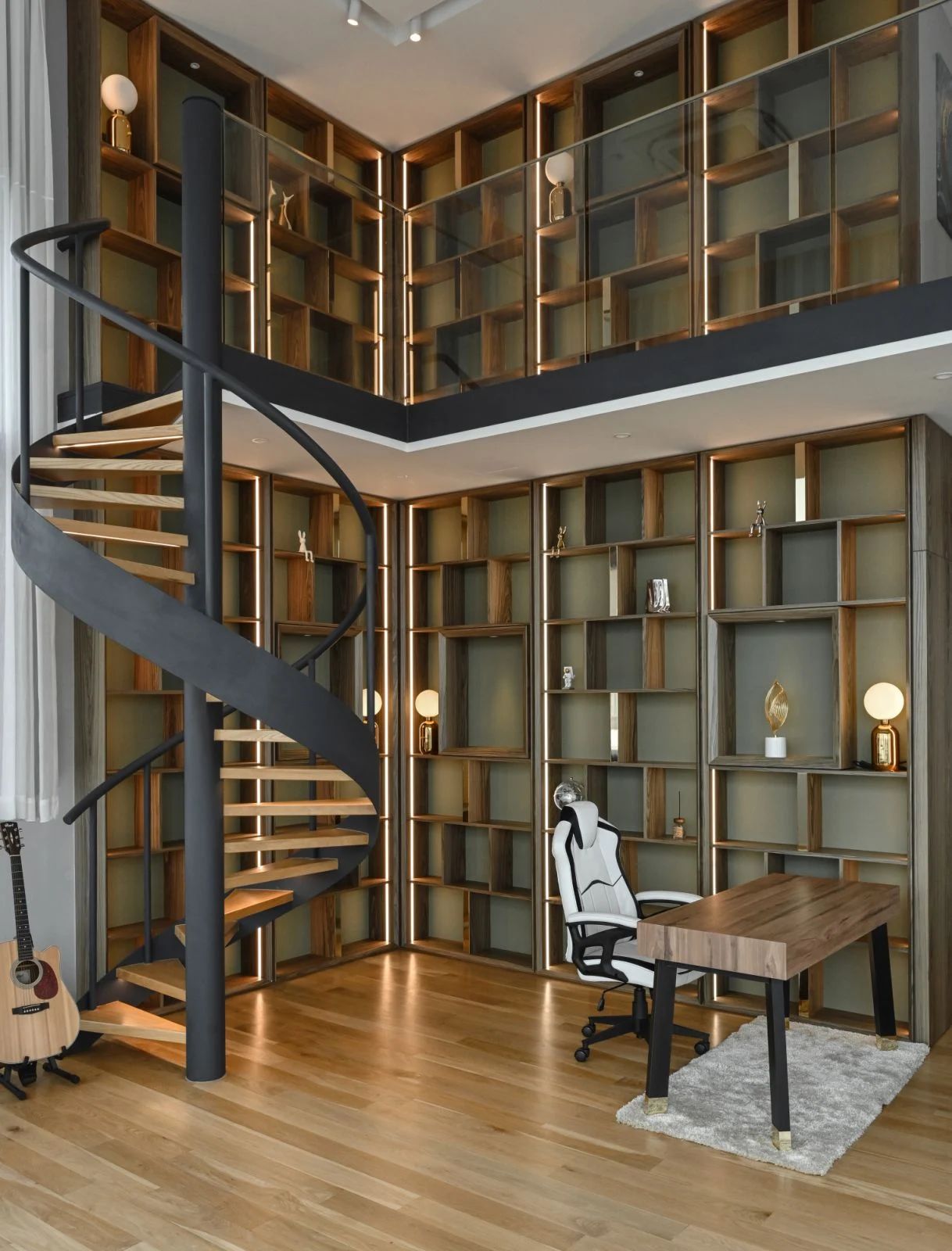 The library loft with a spiral staircase and two-level bookshelf  (Photo: Gavin Yam)