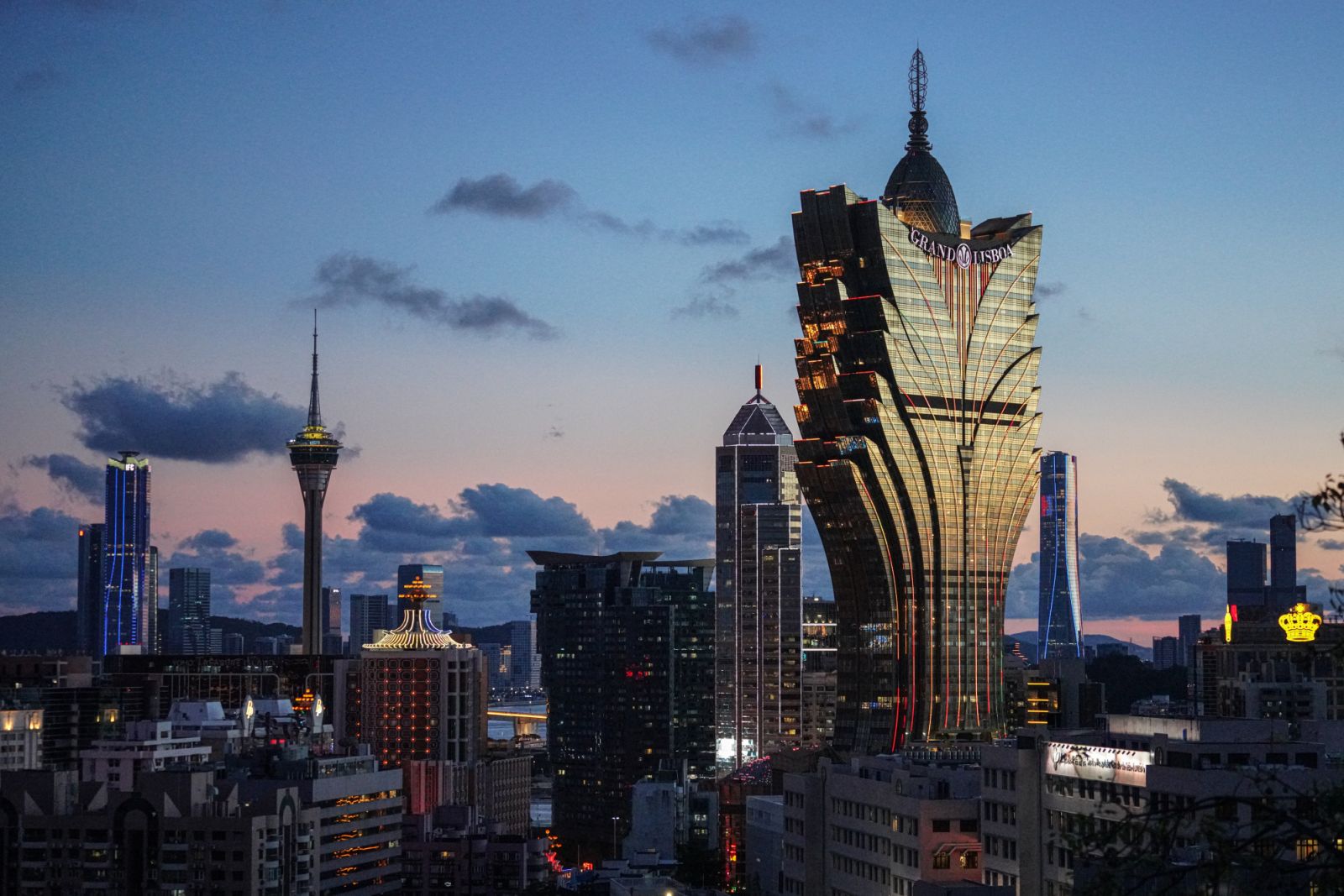 MACAU, CHINA - 2023/07/24: Cityscape of Macau Island at night with hotel Grand Lisboa in the foreground. (Photo by Michael Ho Wai Lee/SOPA Images/LightRocket via Getty Images)