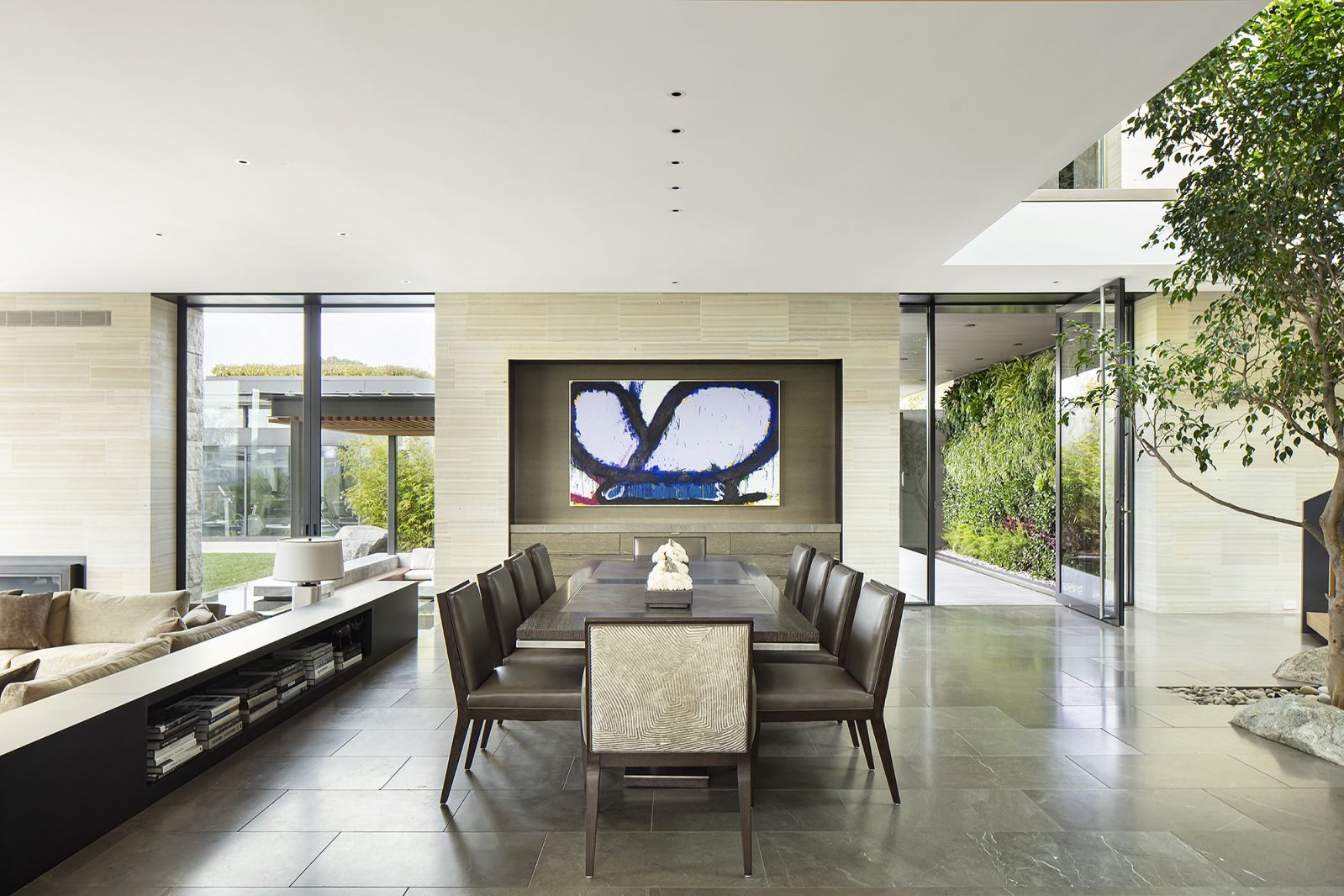 The custom dining table nickelled with an acid-etched aluminium centrepiece