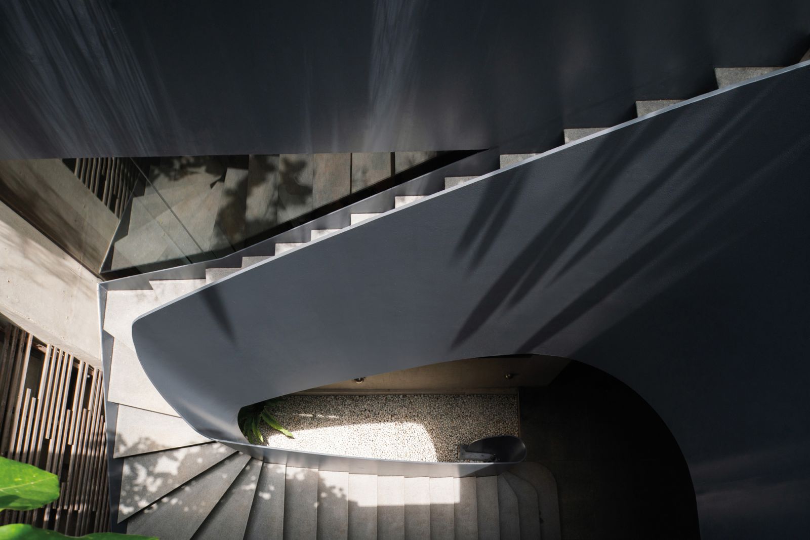 Dappled sunlight brings an organic quality to the chiselled stairway