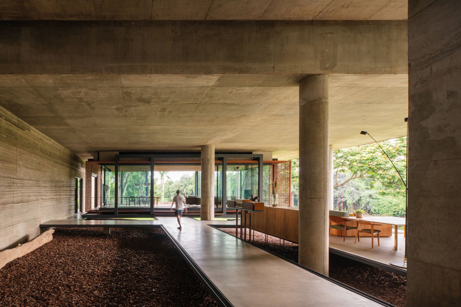 The ground-floor spaces are designed as pavilions connected by walkways