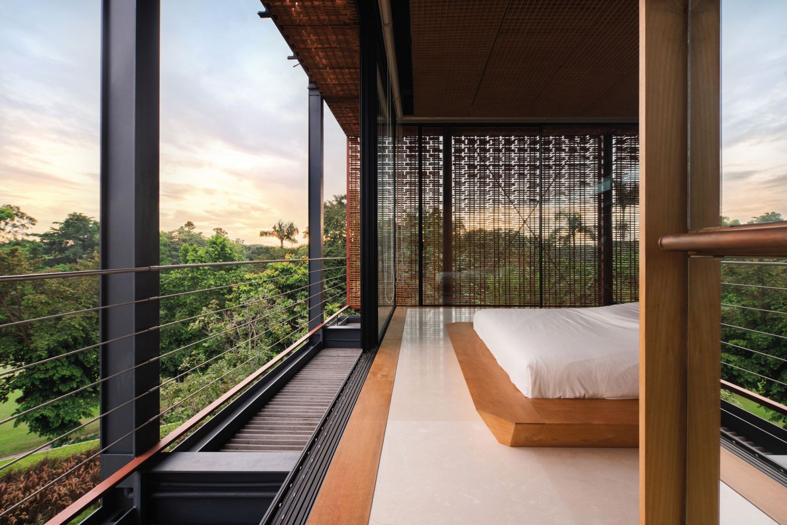 The master bedroom boasts expansive views of the secluded neighbourhood