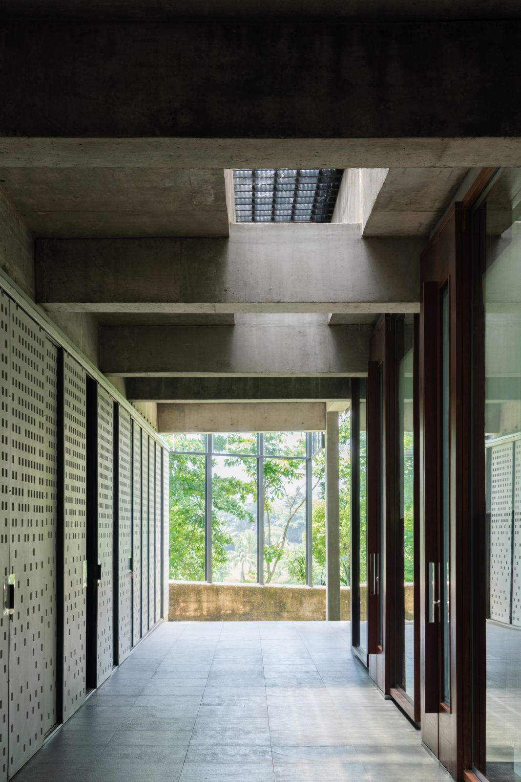 This perforated fibre cement screen shields the service corridor from view