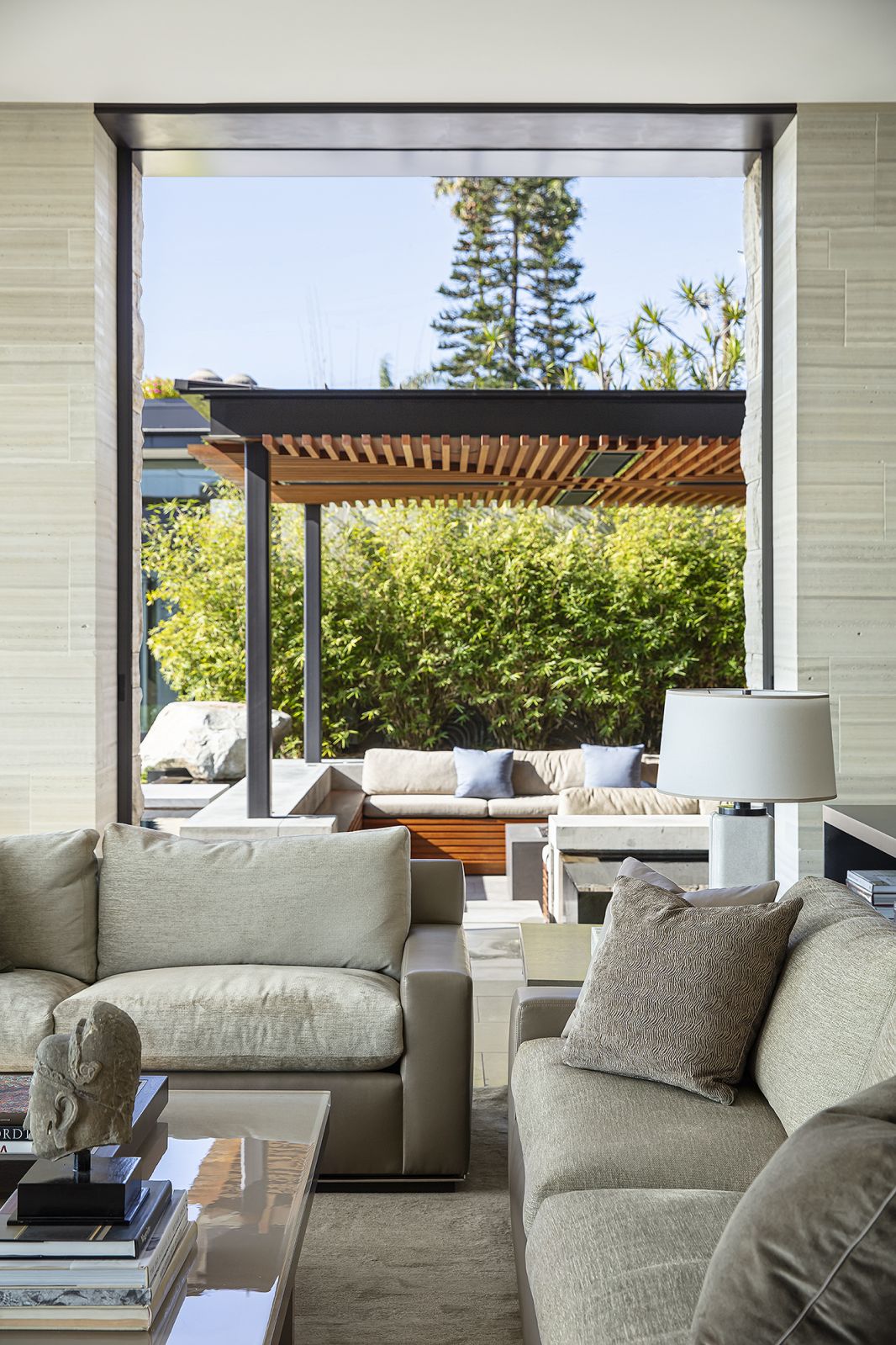 The outdoor seating area is an extension of the living room