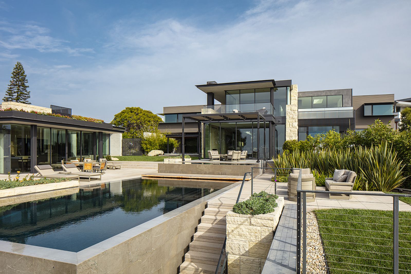 The attached properties are anchored by a sprawling pool