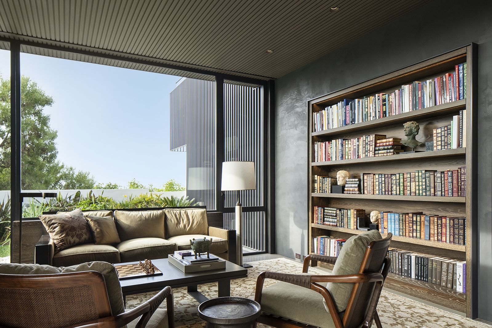 The stone aesthetic juxtaposes rich materials of steel and wood