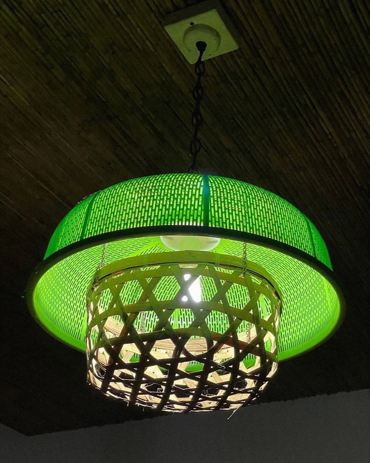 A lamp made out of a plastic food cover and a bamboo basket by artist Ling Quisumbing Ramilo for Tropikalye (Photo: Lena Cobangbang)