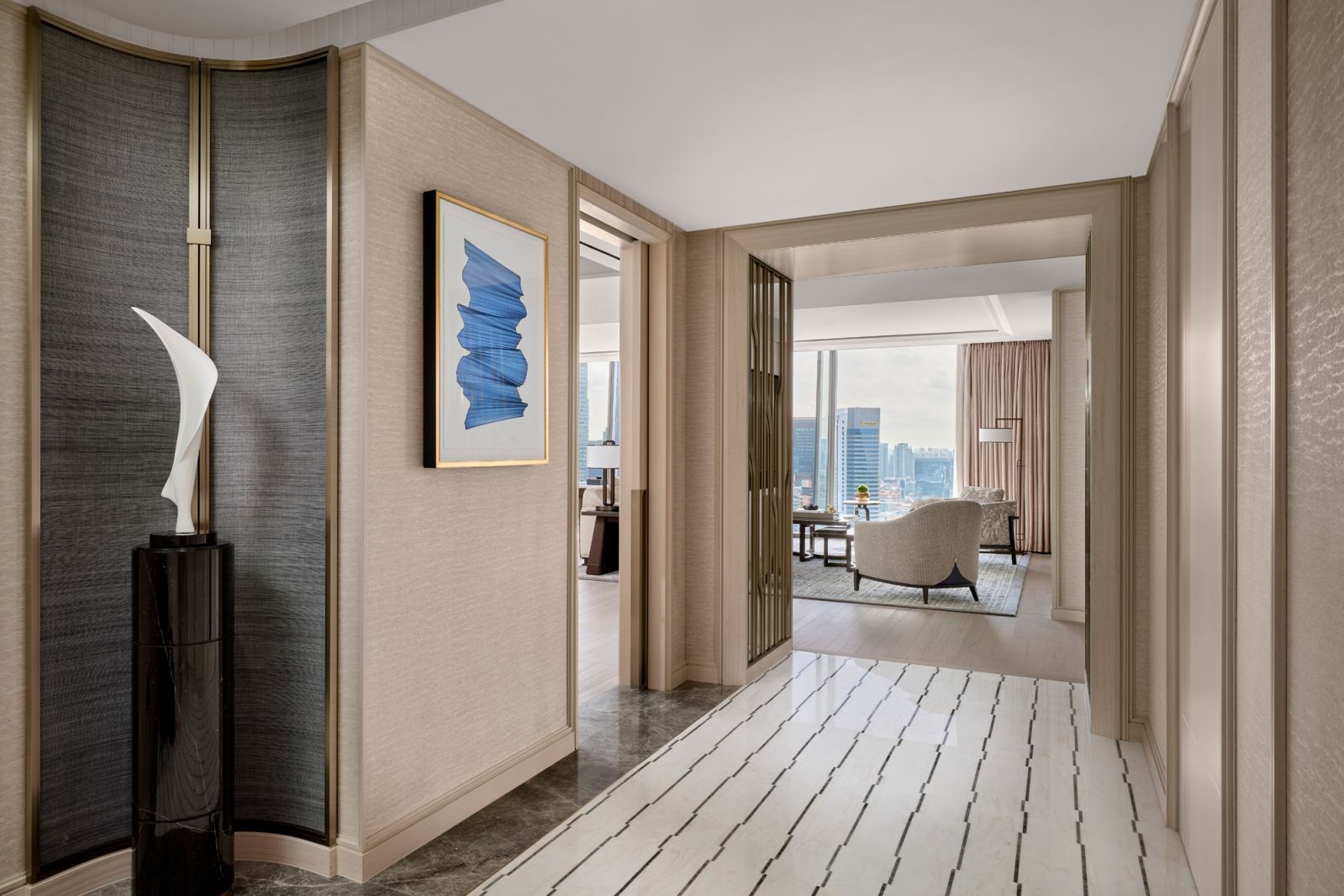 Intricate marble marquetry at the foyer welcomes guests with a calming palette