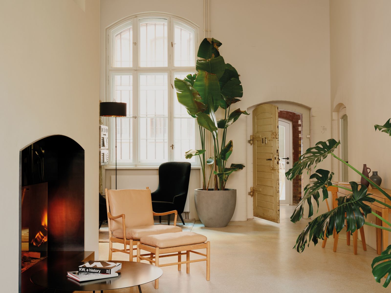 Whitewashed walls serve as a clean canvas for the selection of furniture in the lobby