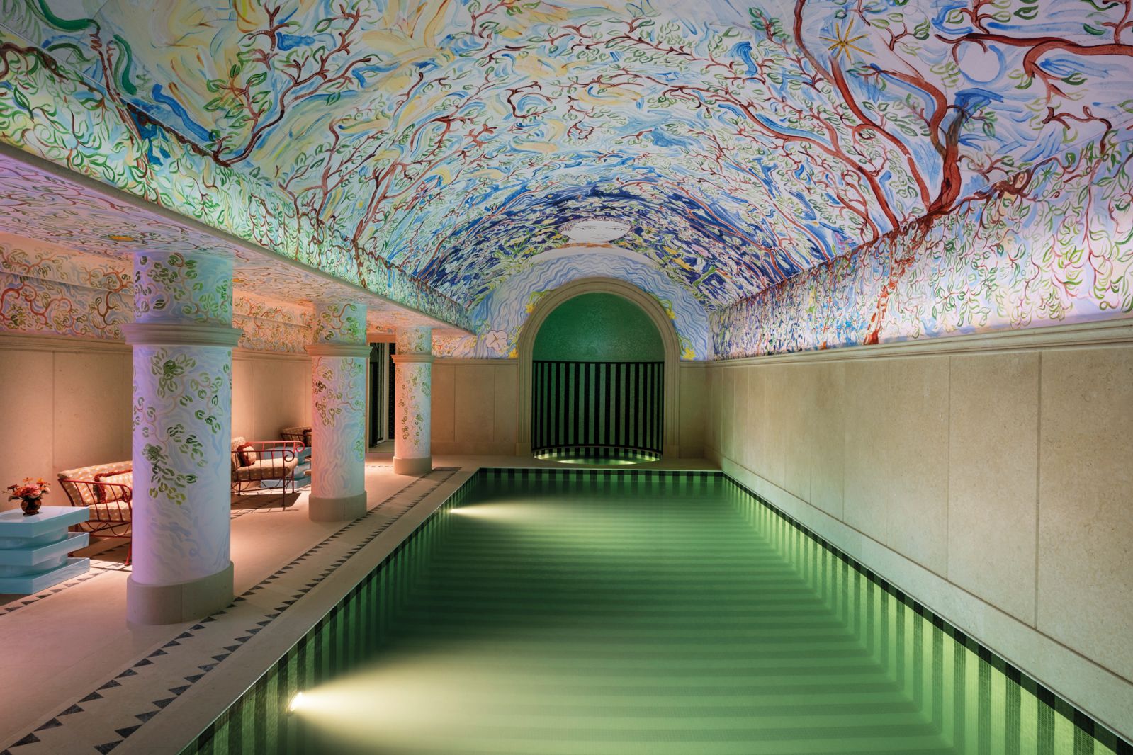 The pool features an arched ceiling with a beautifully intricate mural