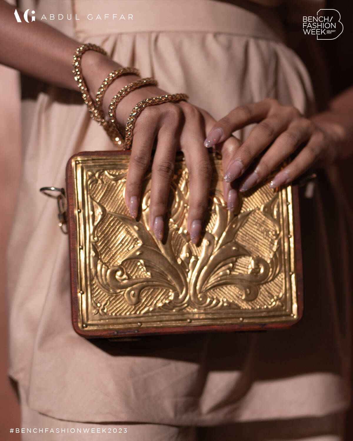 A clutch with brass details by Abdul Gaffar