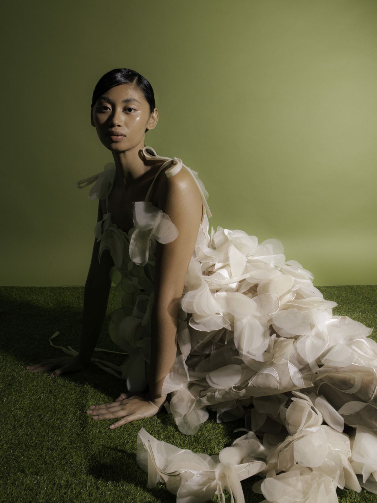 A model wears a pearlescent gown by Renz Reyes