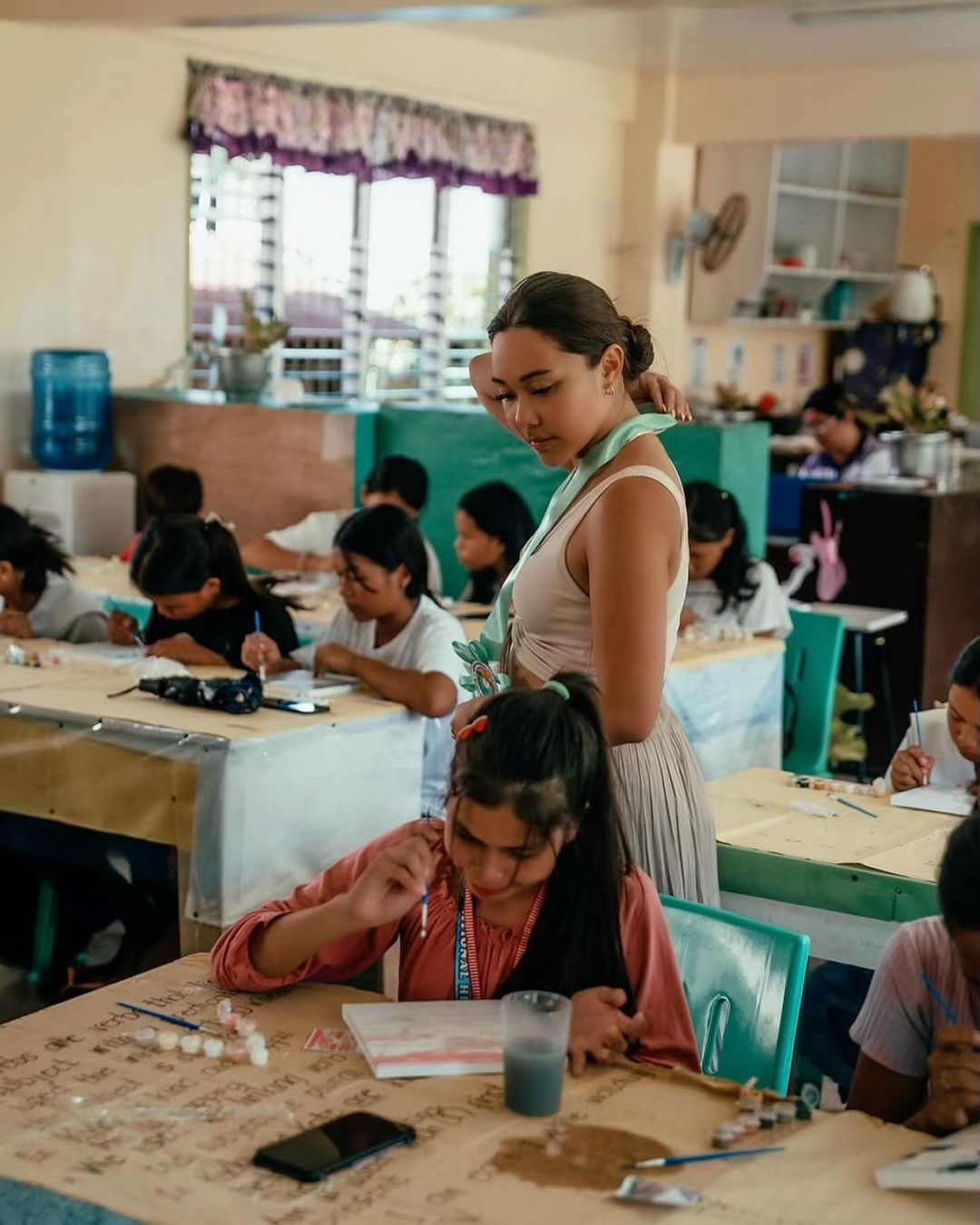 Kim Cruz hosts an art session with the community in Siargao Island, Philippines