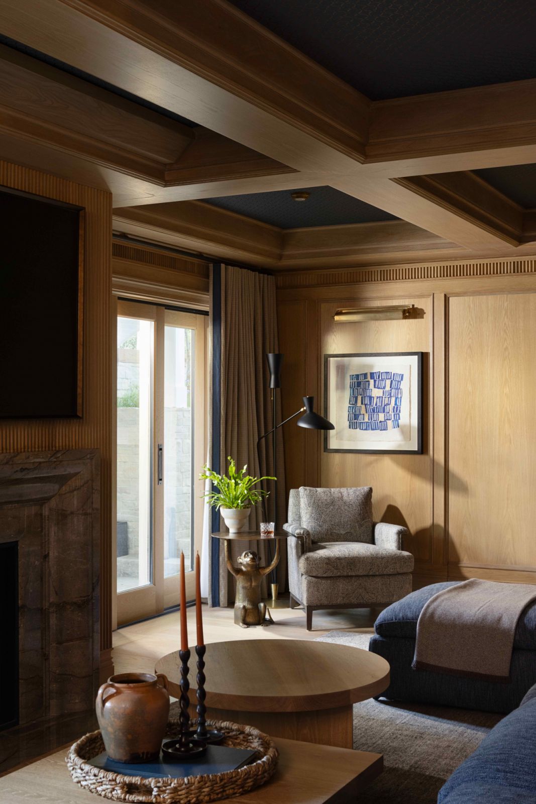 The richer toned recreation room clad in whitewashed oak panels