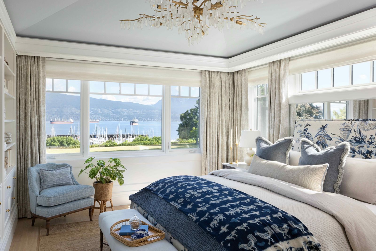 The primary bedroom with afforded views of the ocean and mountains beyond