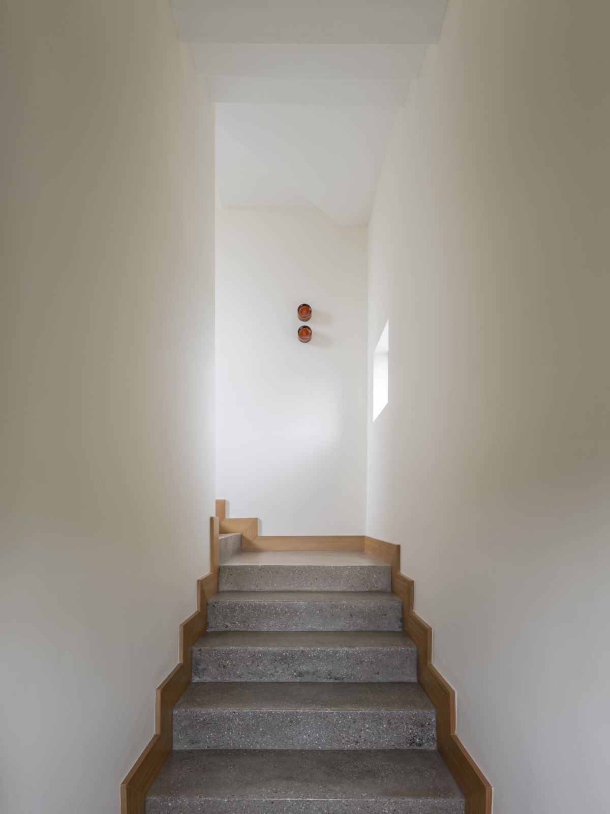 The staircases feature custom lighting