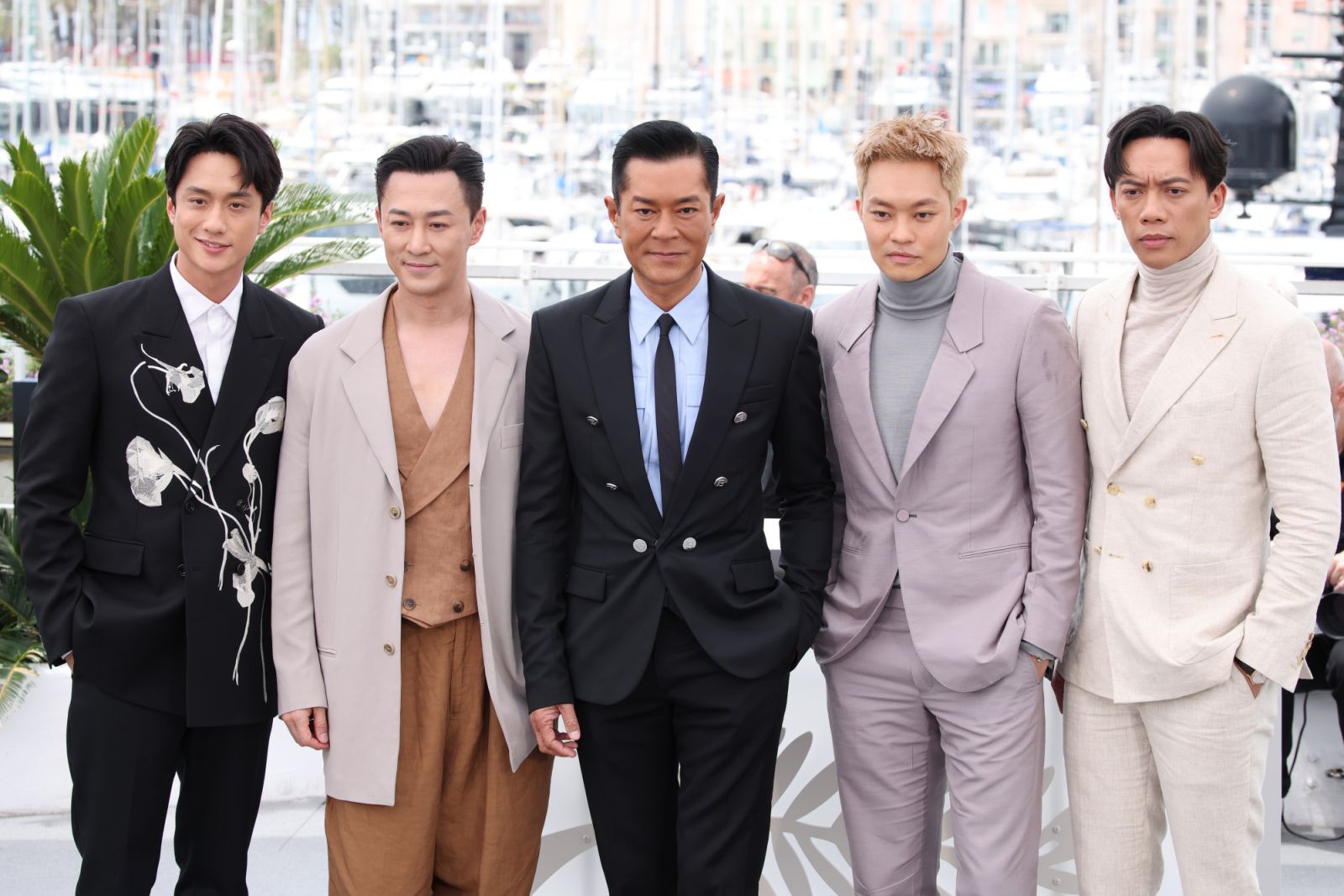 CANNES, FRANCE - MAY 16: Terrance Lau, Raymond Lam, Louis Koo, Tony Wu and German Cheung attends the "Twilight Of The Warriors: Walled In" (City Of Darkness) Photocall at the 77th annual Cannes Film Festival at Palais des Festivals on May 16, 2024 in Cannes, France. (Photo by Daniele Venturelli/WireImage)