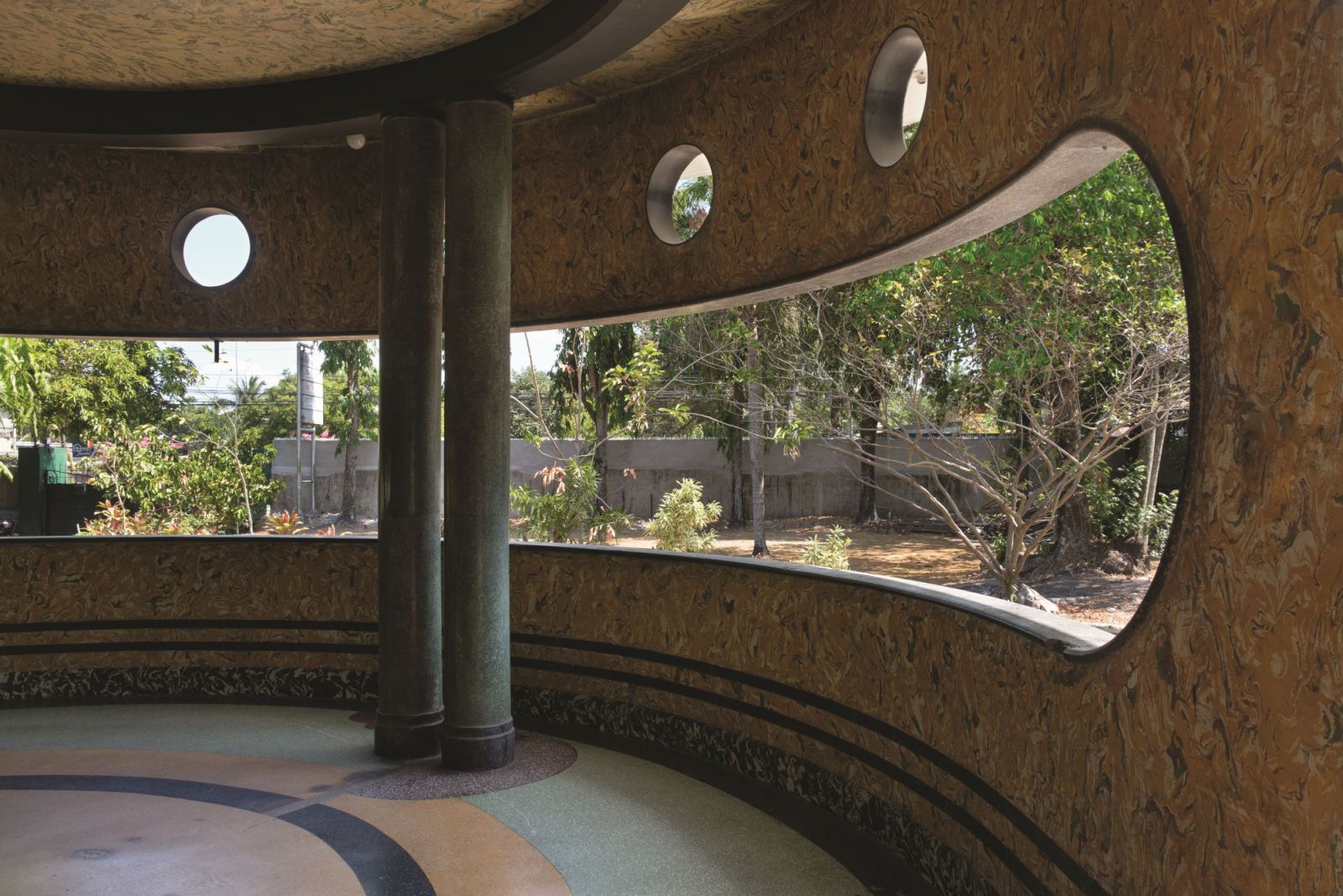 The half-moon-shaped balcony adjacent to the dining room