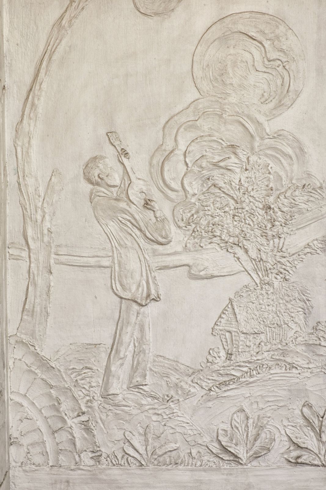 Detail of a large relief showing a farmer singing ‘harana’