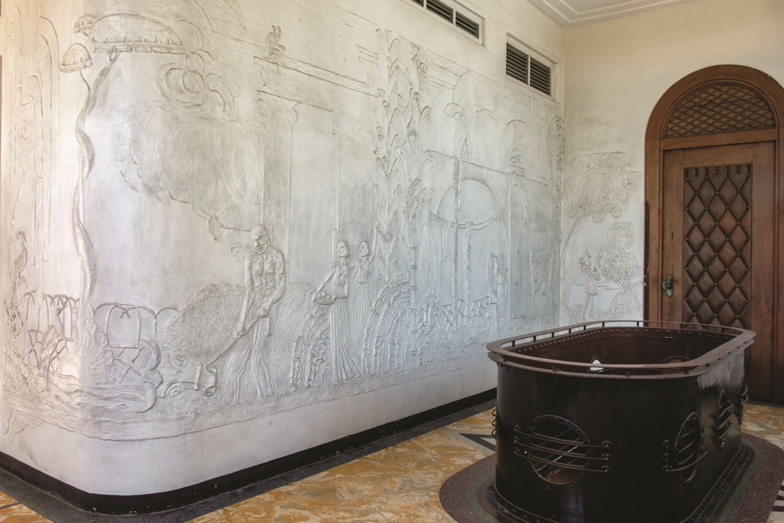 Above the main entrance is a large relief depicting the idyllic life in Negros