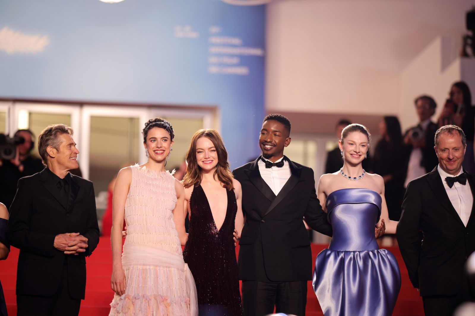 CANNES, FRANCE - MAY 17: Willem Dafoe, Margaret Qualley, Emma Stone, Mamoudou Athie, Hunter Schafer and Andrew Lowe depart the "Kinds Of Kindness" Red Carpet at the 77th annual Cannes Film Festival at Palais des Festivals on May 17, 2024 in Cannes, France. (Photo by Andreas Rentz/Getty Images)