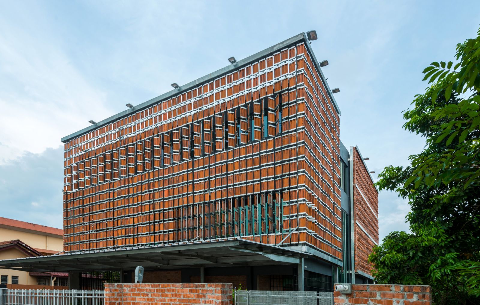 Dr Tan Loke Mun's Clay Roof House uses recycled tiles and bricks