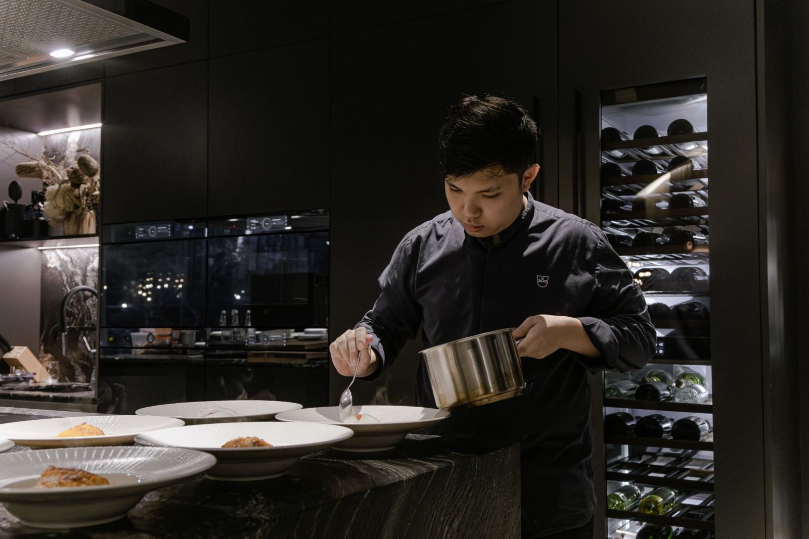 Chef Ow is a picture of concentration during a plating session
