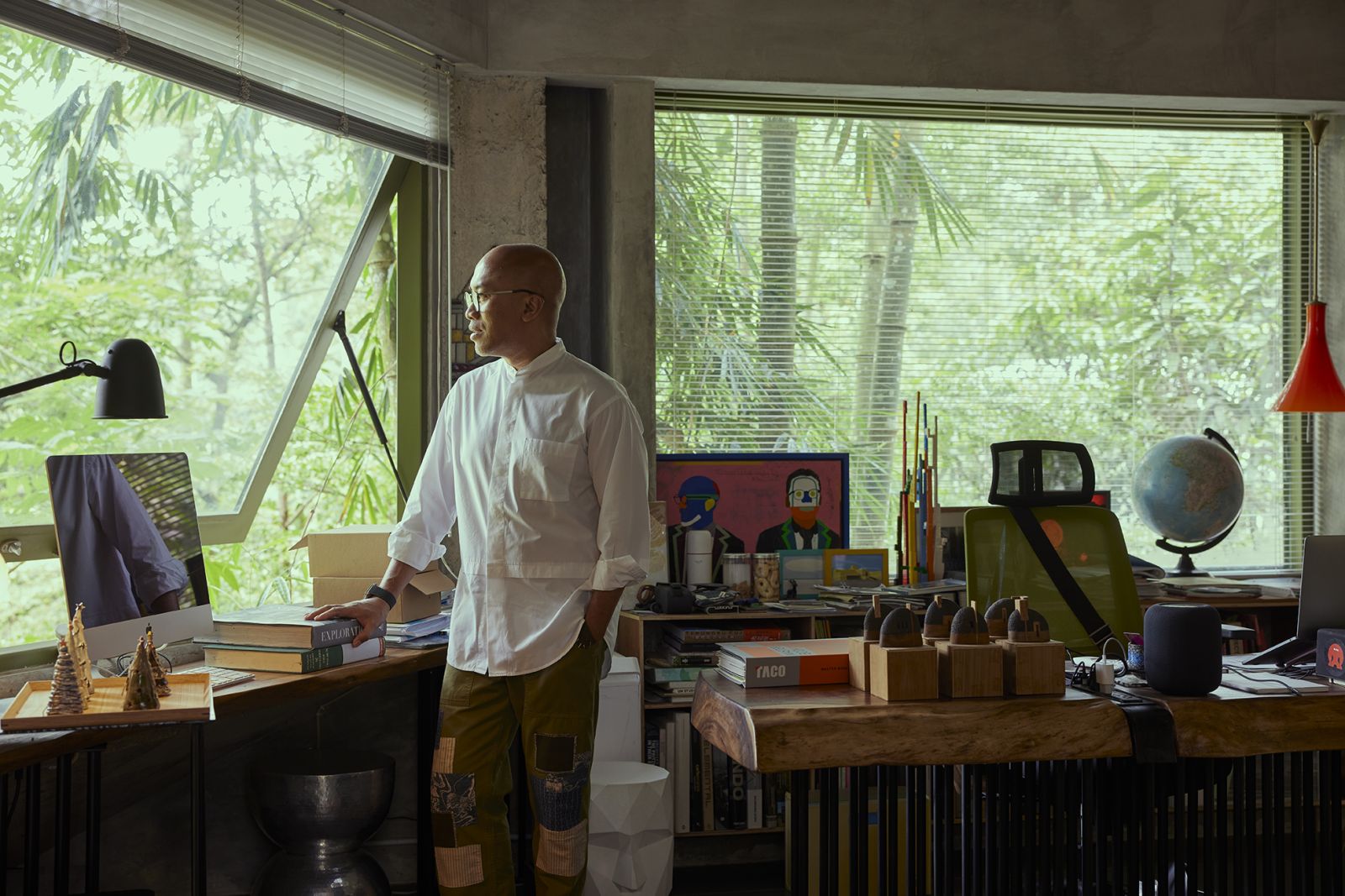 Indrajanto’s personal office is an artistic chaos populated with books and artworks by local talents