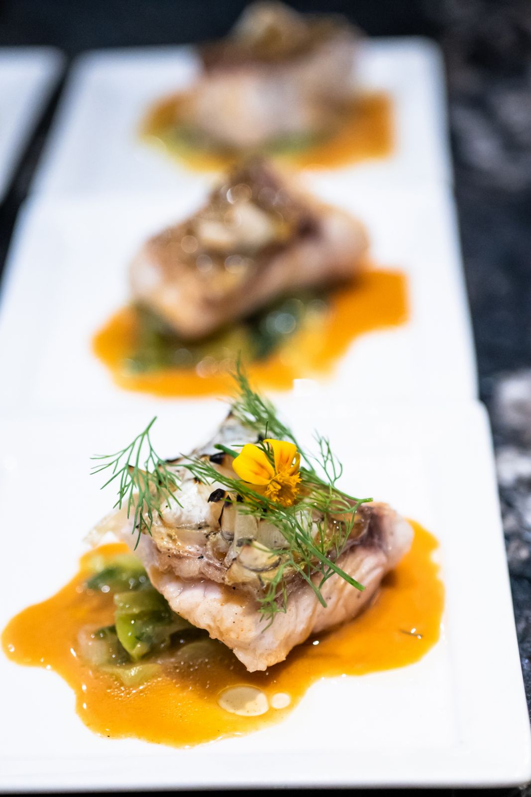 Locally farmed seabass, complete with crispy scales