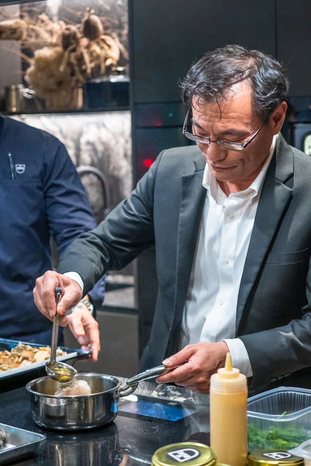 XXX trying his hand at cooking the zero-waste seabass with crispy scales