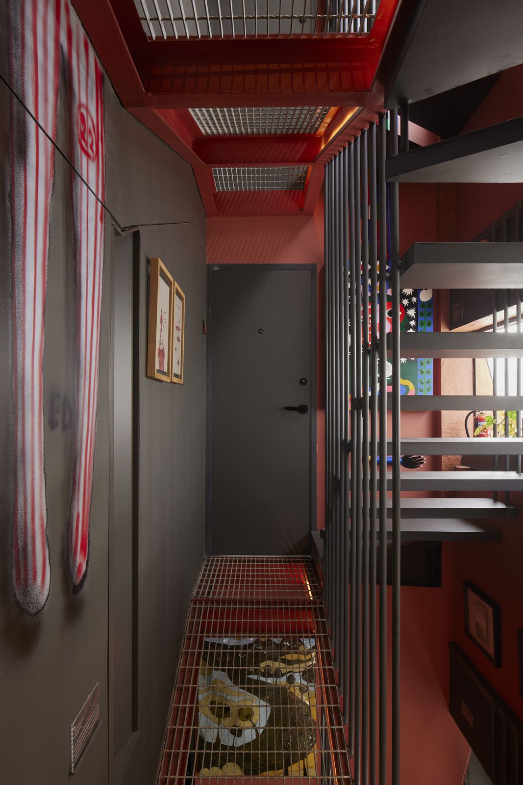 A corridor in PituRooms, showcasing art of various mediums and themes