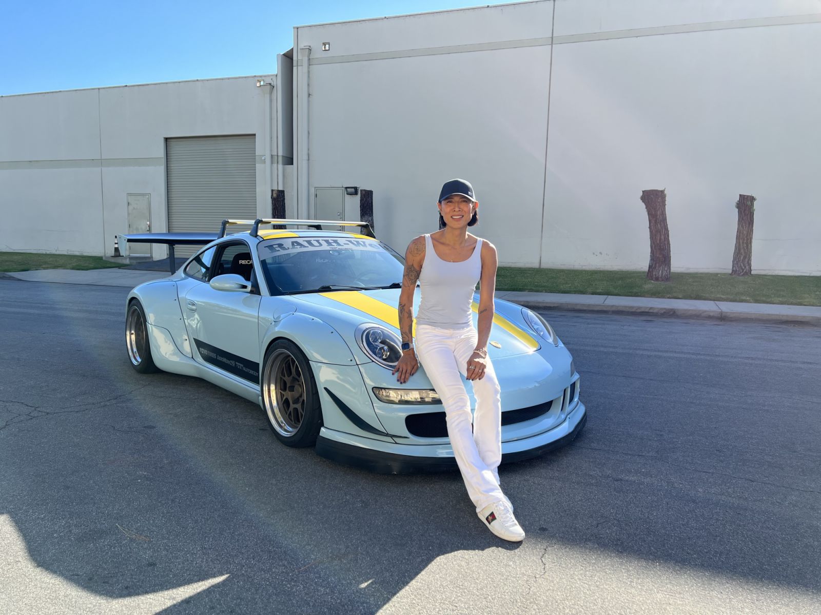 Angie Mead King with an RWB Porsche Carrera 4 (2007)