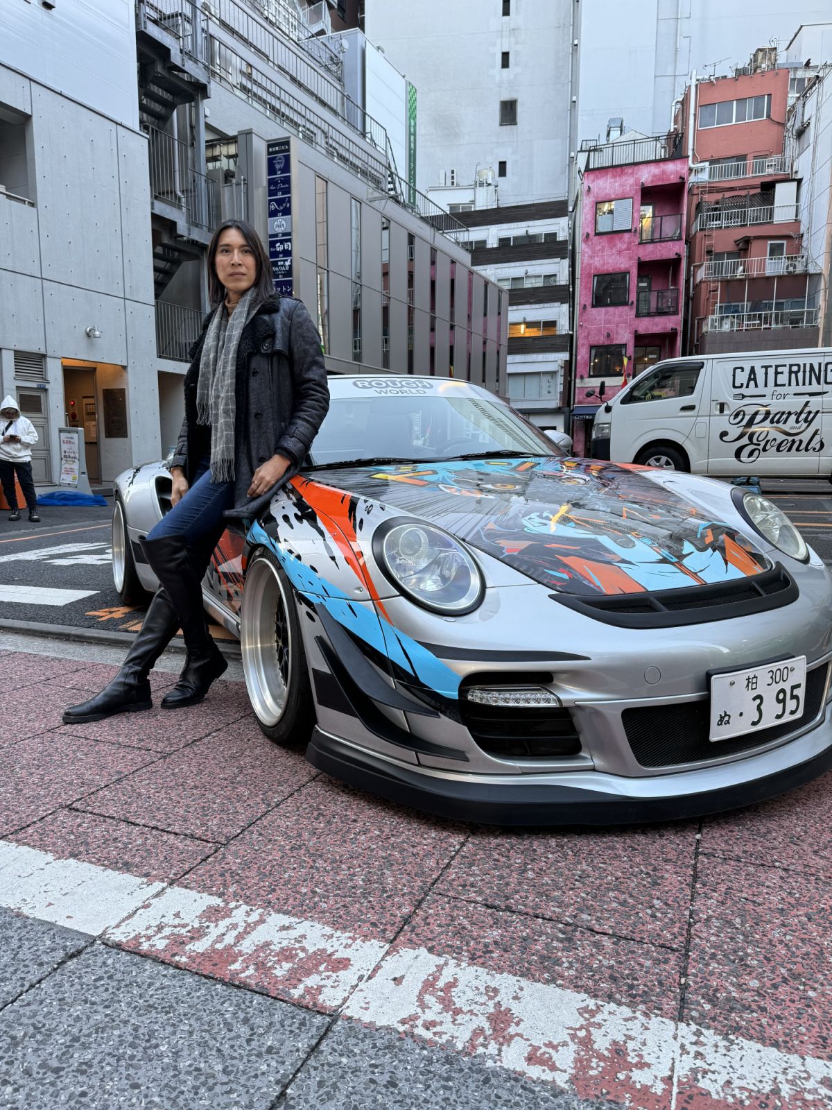 Angie Mead King with an RWB Porsche in Japan