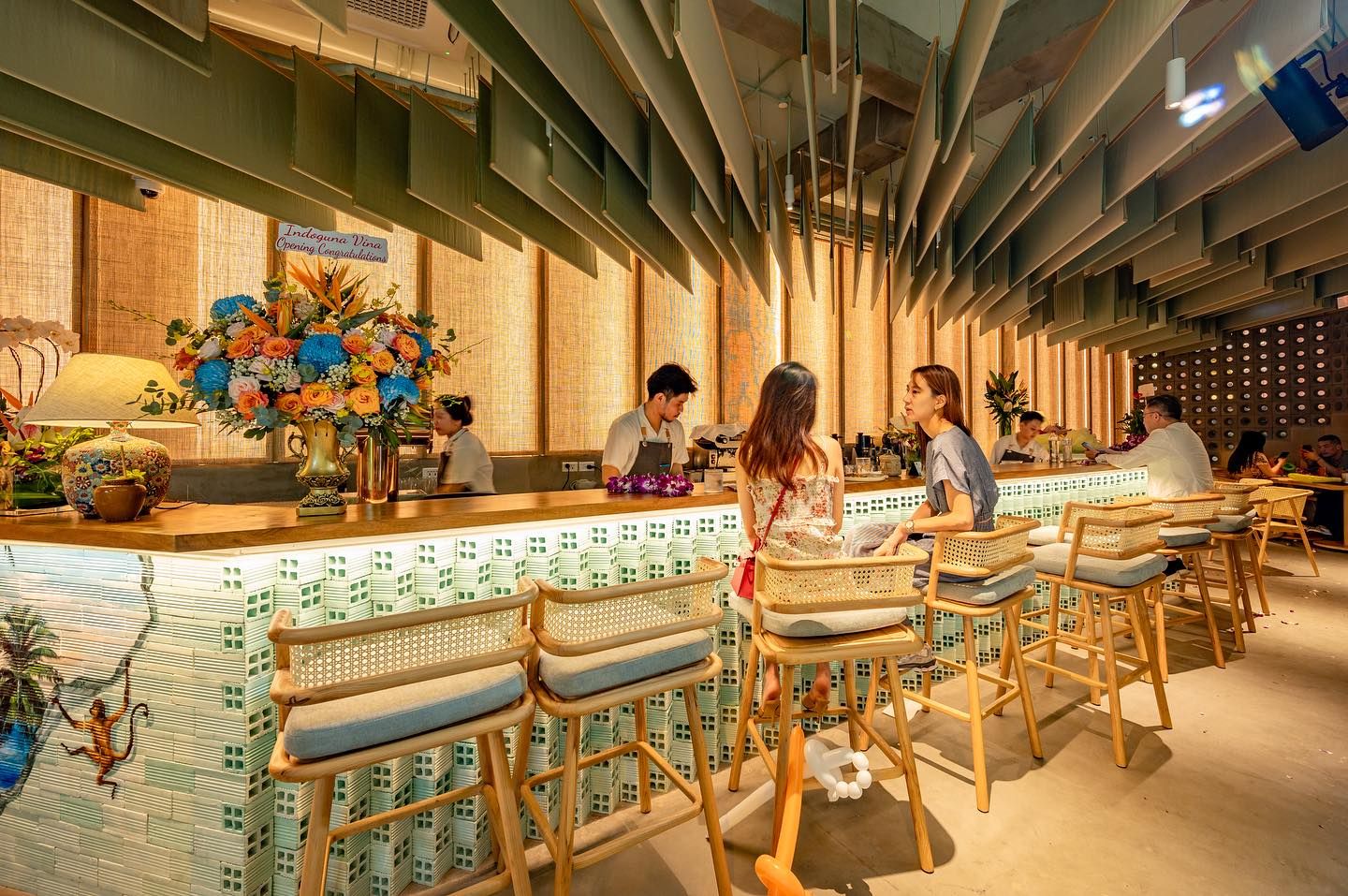 1st floor café in the evening with feature fabric ceiling (ebb)