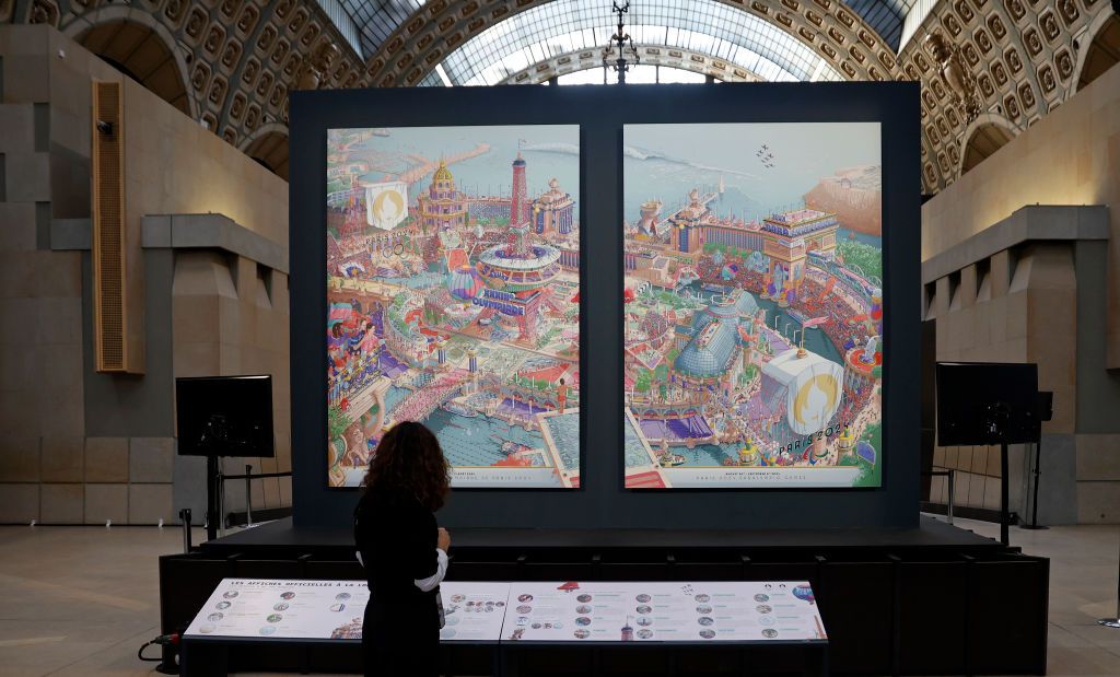 PARIS, FRANCE - MARCH 04: A visitor looks at the Olympic and Paralympic posters for the Paris 2024 Games at the Orsay Museum on March 04, 2024 in Paris, France. These posters for the Paris 2024 Games designed by Ugo Gattoni were unveiled today at the Musee d'Orsay. The posters, one for the Olympic Games, the other for the Paralympics, “can exist one without the other, but form a whole side by side, in order to give the overall vision of Paris 2024”. Paris will host the Summer Olympics from July 26 till Augu