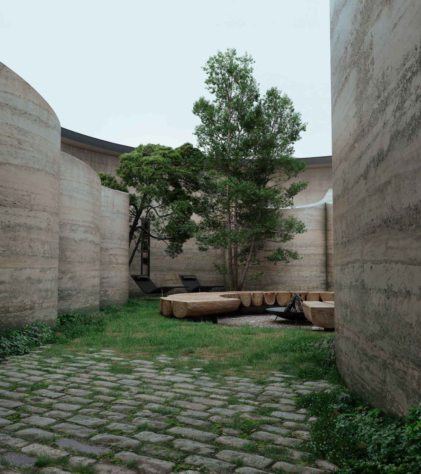 The curved forms are achieved using a traditional rammed earth technique